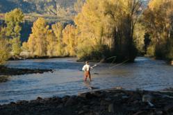 An early morning fly fisherman tests the waters at Rainbow Trout Ranch